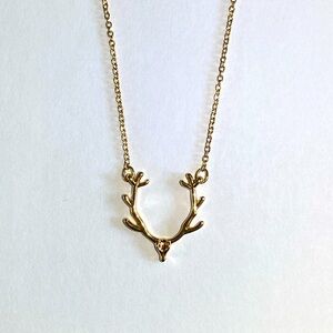 Delicate gold deer antler necklace